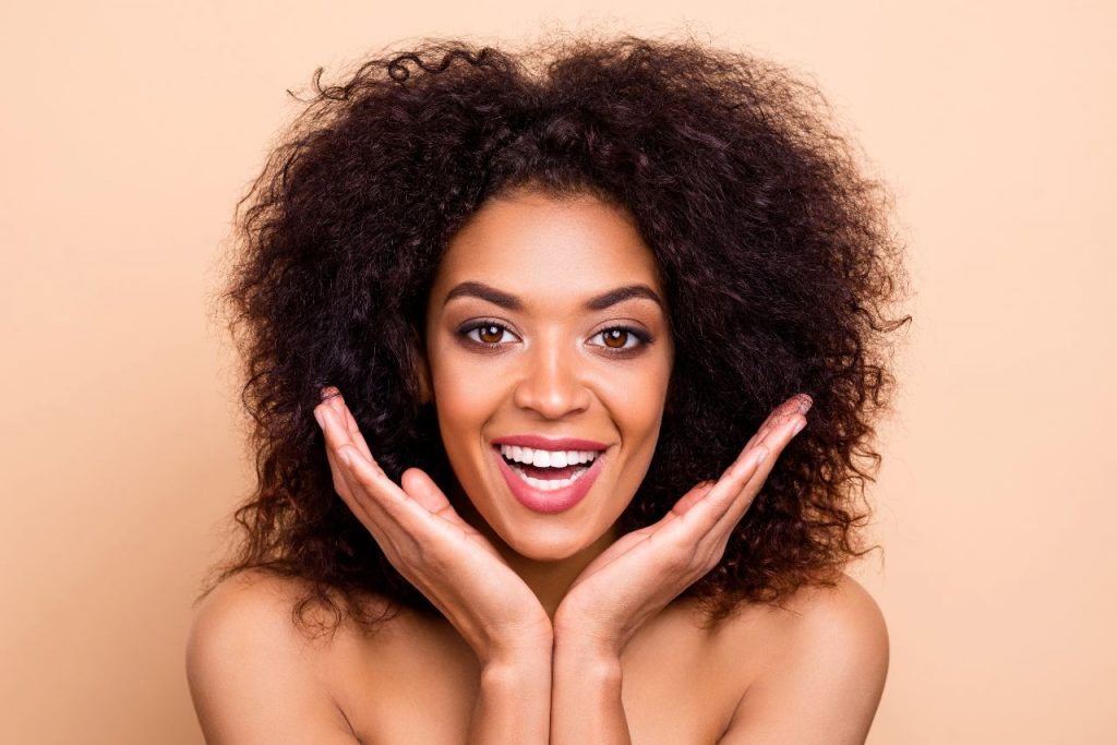 Happy smiling woman after anti-wrinkle treatment